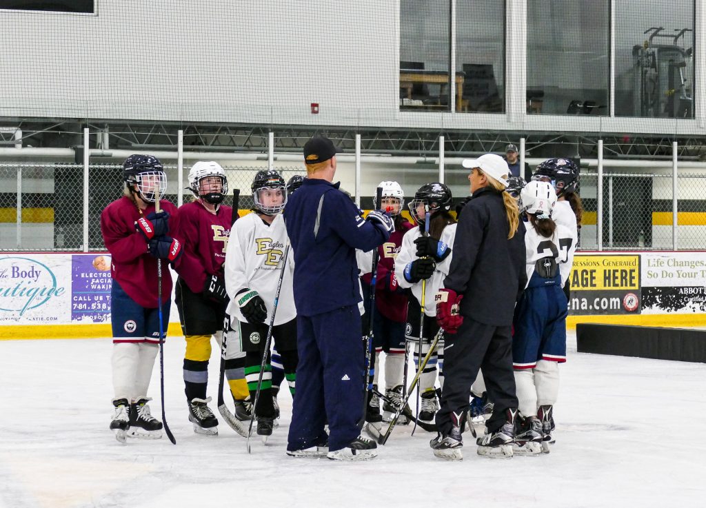 female athletes talking to their coach